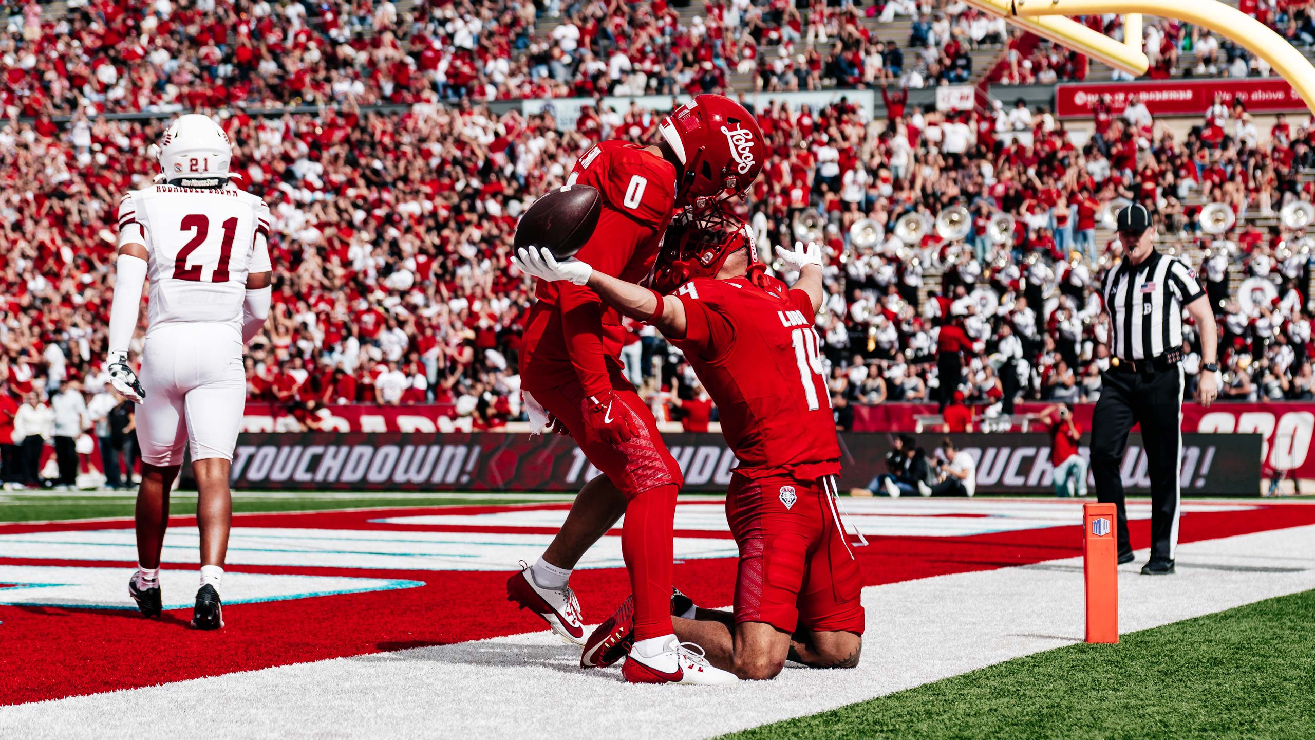 Football players celebrating in end zone